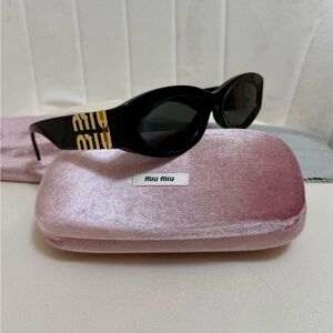 Miu Miu Black Oval Sunglasses with Gold Logo Temples